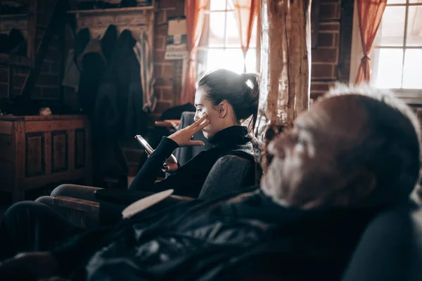 Elderly Man Watching His Granddaughter His Side Looking Her Phone — Stock Photo, Image