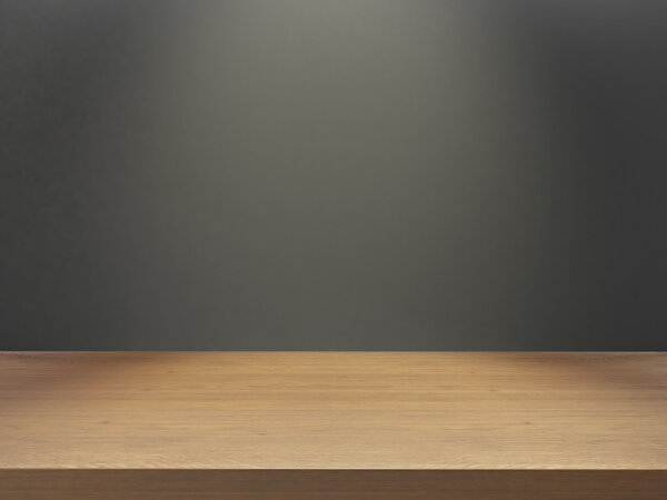 деревянный стол с серой стеной под светом
