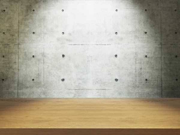 Mesa de madeira com parede de concreto — Fotografia de Stock