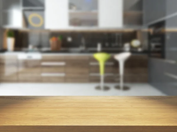 Empty wooden desk with blurred kitchen background — Stock Photo, Image