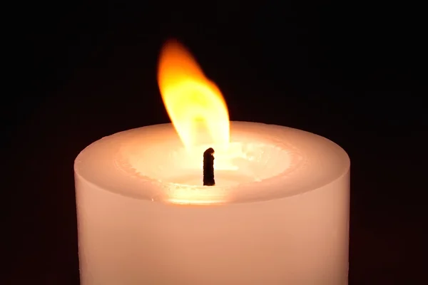 CANDLE ON THE DARK BACKGROUND Royalty Free Stock Images