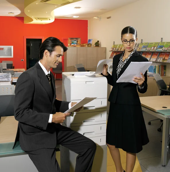 Workers using copy machine iol — Stock Photo, Image