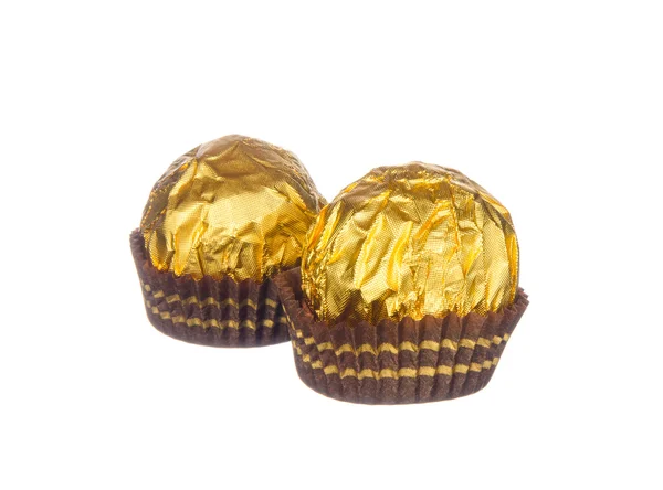 Chocolate balls wraped with golden foil isolated on white — Stok Foto