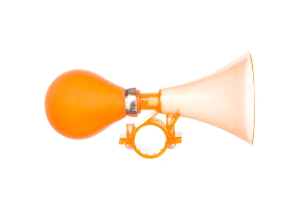 Orange toy trumpet isolated on white — Stock Photo, Image