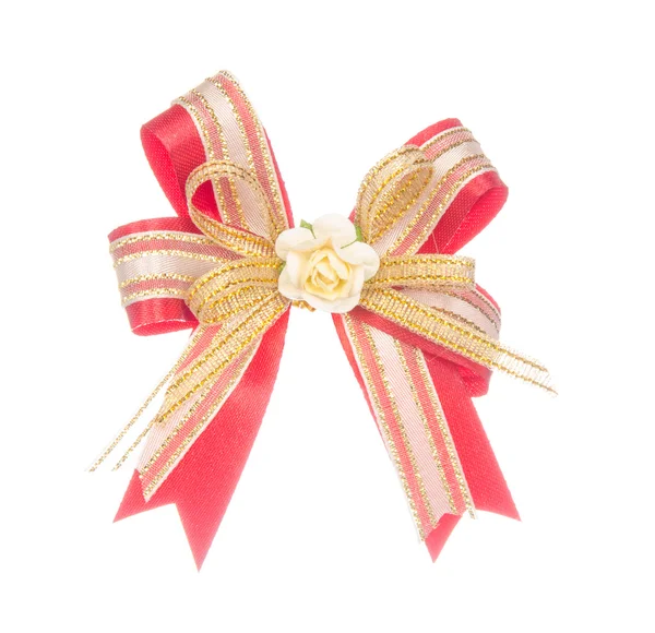 Red ribbon bow with flower isolated on white — Stock Photo, Image