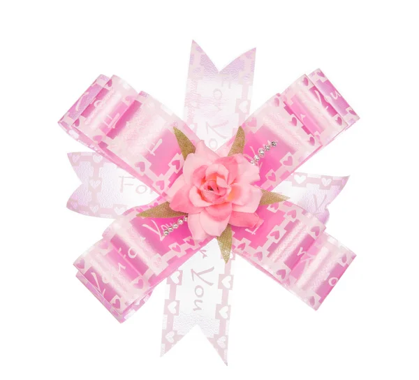 粉红丝带弓与孤立在白色的花 — 图库照片