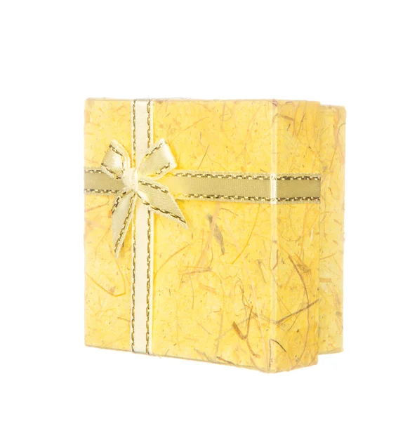 Yellow gift box with ribbon and bow isolated on white — Stock Photo, Image