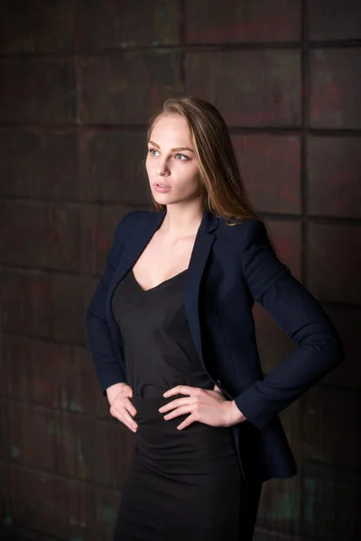 Young beautiful woman, business woman, lady, in a dark black suit,working on the tablet, work, using the tablet — Stockfoto