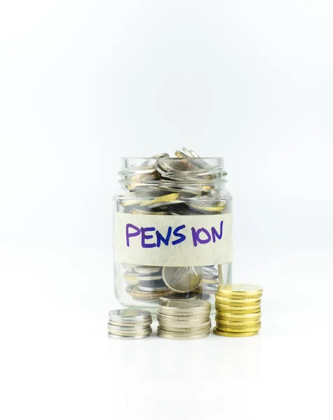 Glass jar with full of coin. Pension Label On Jar over white background — Stock Photo, Image