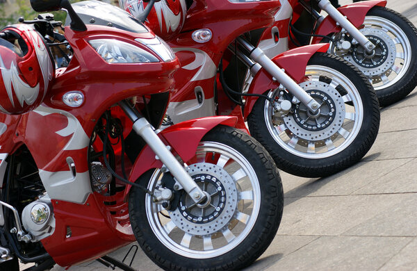 Three red motorcycles