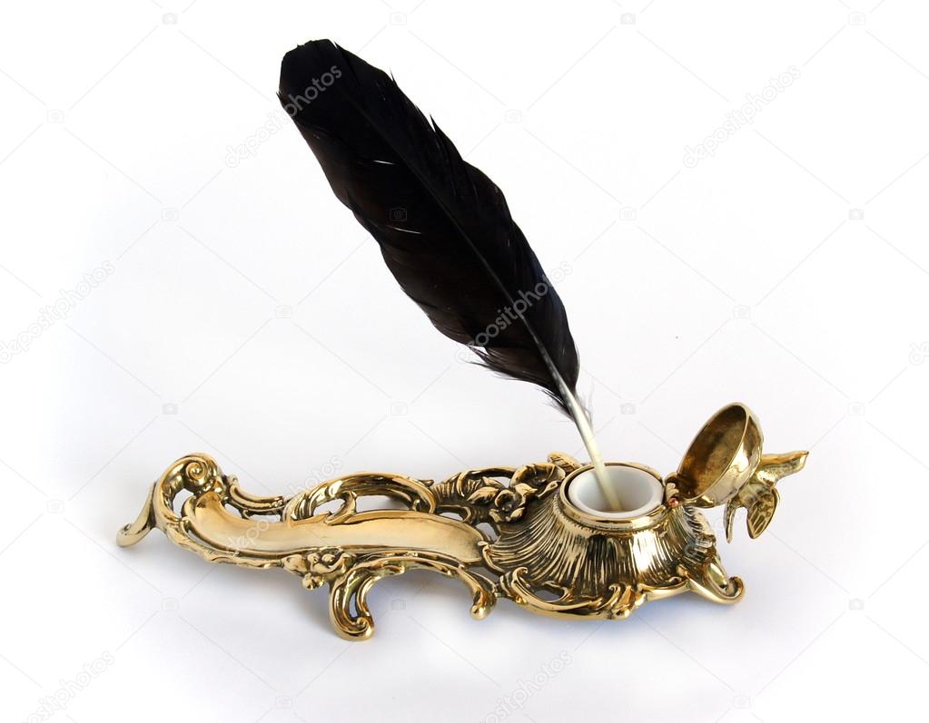 Brass inkwell with feather 