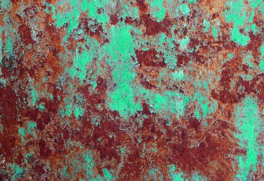 Eşsiz bir soyut arkaplan olarak boya kalıntıları ile paslı çelik levha