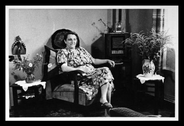 Vintage photo: housewife in an interior clipart