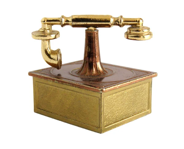 Латунная миниатюра старинного телефона — стоковое фото