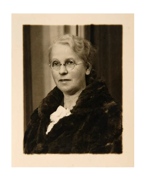 Vintage photo: elderly woman posing in studio — Stock Photo, Image