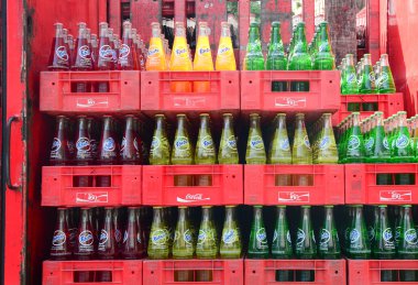 Bottled soft drinks in a supermarket clipart