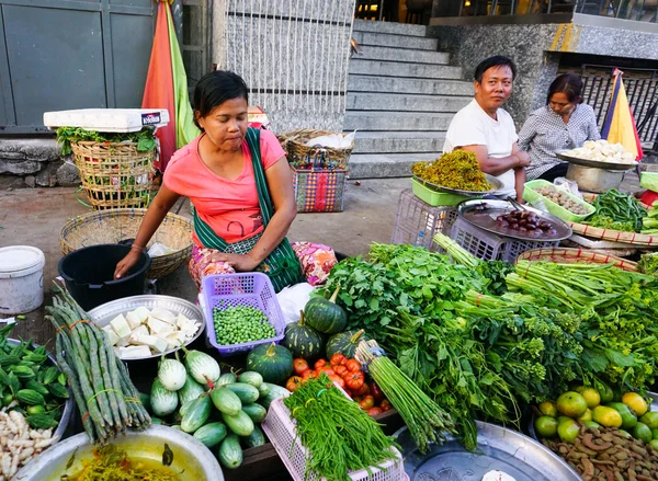 Burmese women selling fresh fruits at Bogyoke market