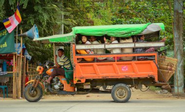 Burmese people on the local bus clipart