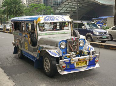 Jeepney on the street in Manila clipart