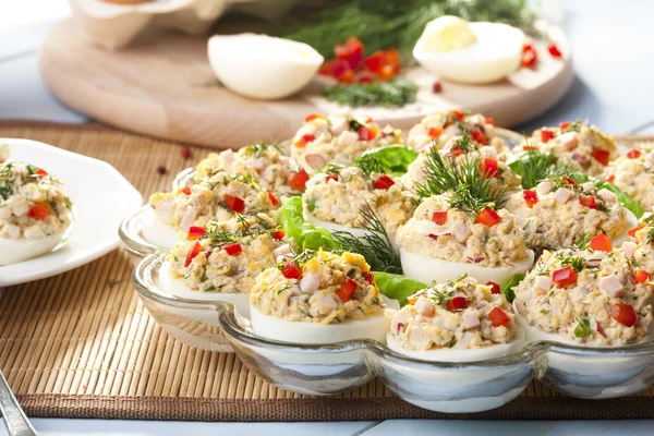 Stuffed eggs with ham, red pepper and dill — Stock Photo, Image