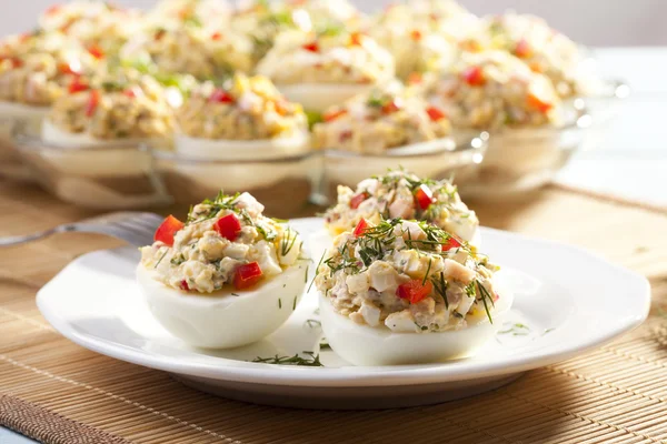 Stuffed eggs with ham, red pepper and dill — Stock Photo, Image
