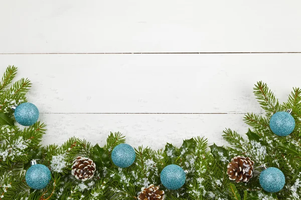 Christmas decoration on the wooden white background with snow or — Stock Photo, Image