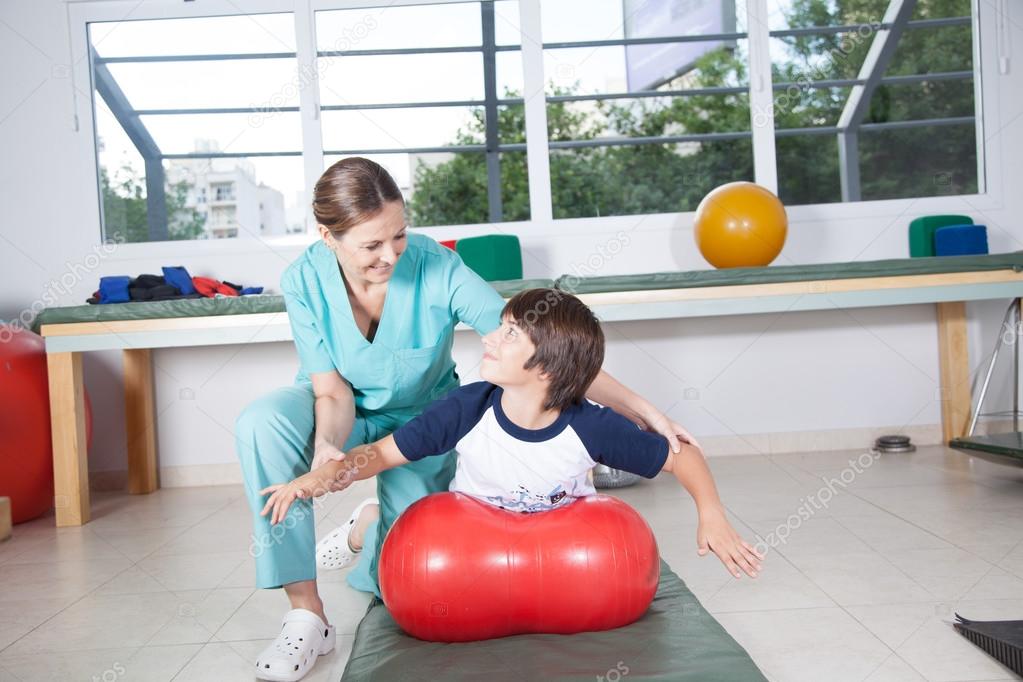 Therapist woman working  with boy