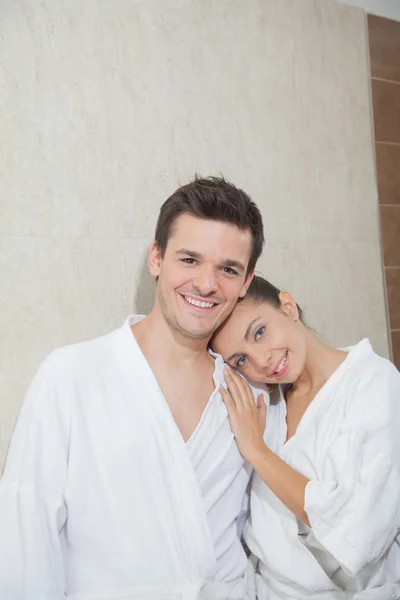 Happy couple hugging in bathroom — Stock Photo, Image