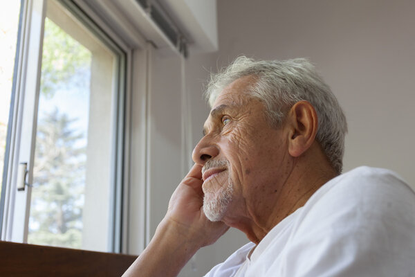 Man on a wheelchair looking for a window 