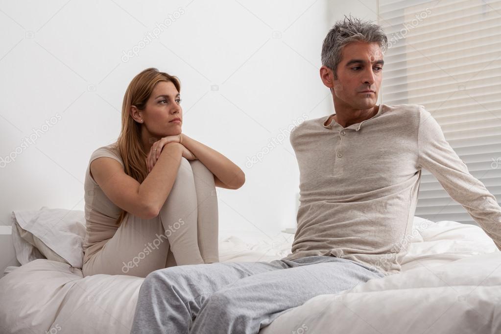 Angry couple in bed