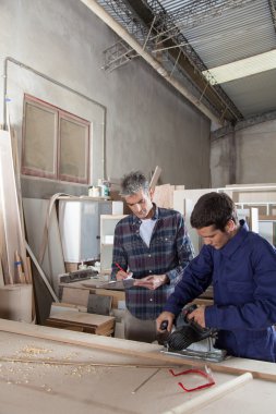 Two carpenters working clipart