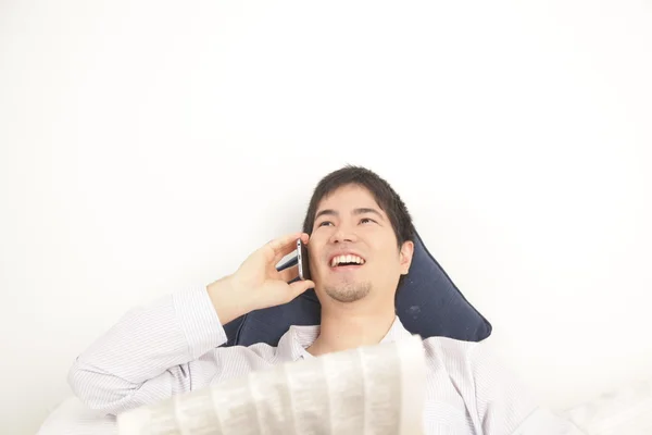 Asian an talking on mobile phone — Stock Photo, Image