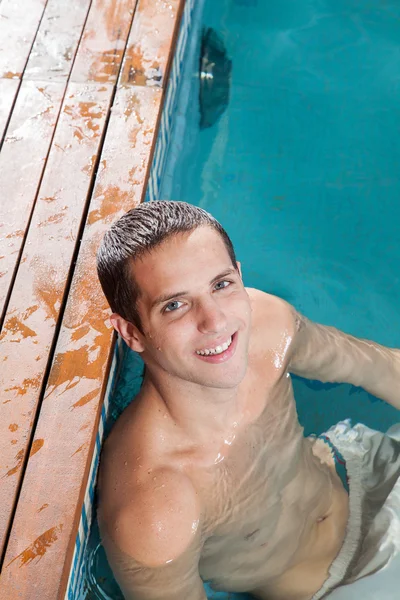 Man resting in the pool — стоковое фото