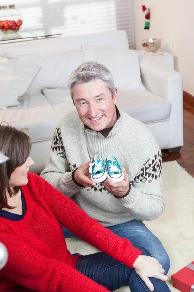 Couple with little shoes in christmas — Stock Photo, Image