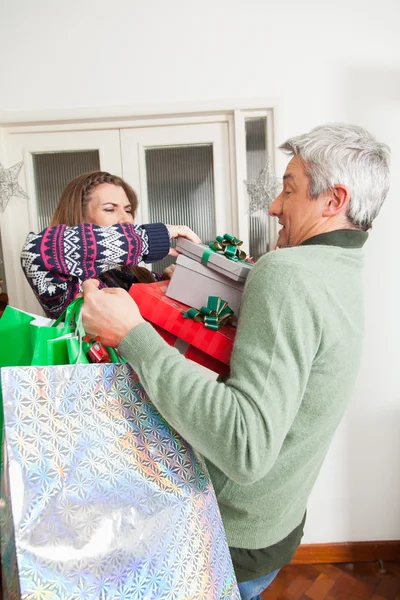 Man holding a lot of gift — Stock Photo, Image