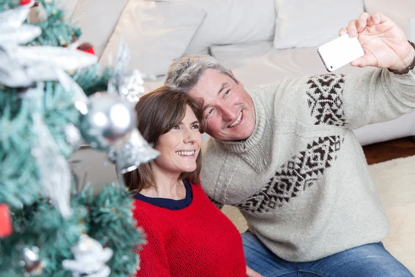 Couple taking a photo in christmas — Stock Photo, Image