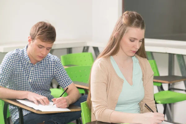 Friends studying in classroom — Stock Photo, Image