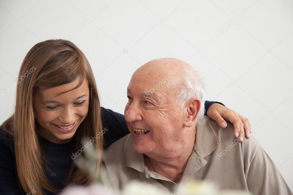 girl having fun with her grandfather