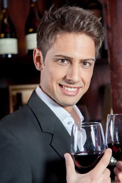 Man holding a wineglasses — Stock Photo, Image
