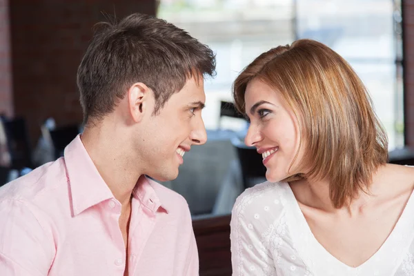 Couple in love sitting at restaurant — Stock Photo, Image