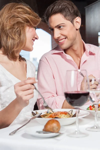 Couple in love sitting at restaurant Royalty Free Stock Photos