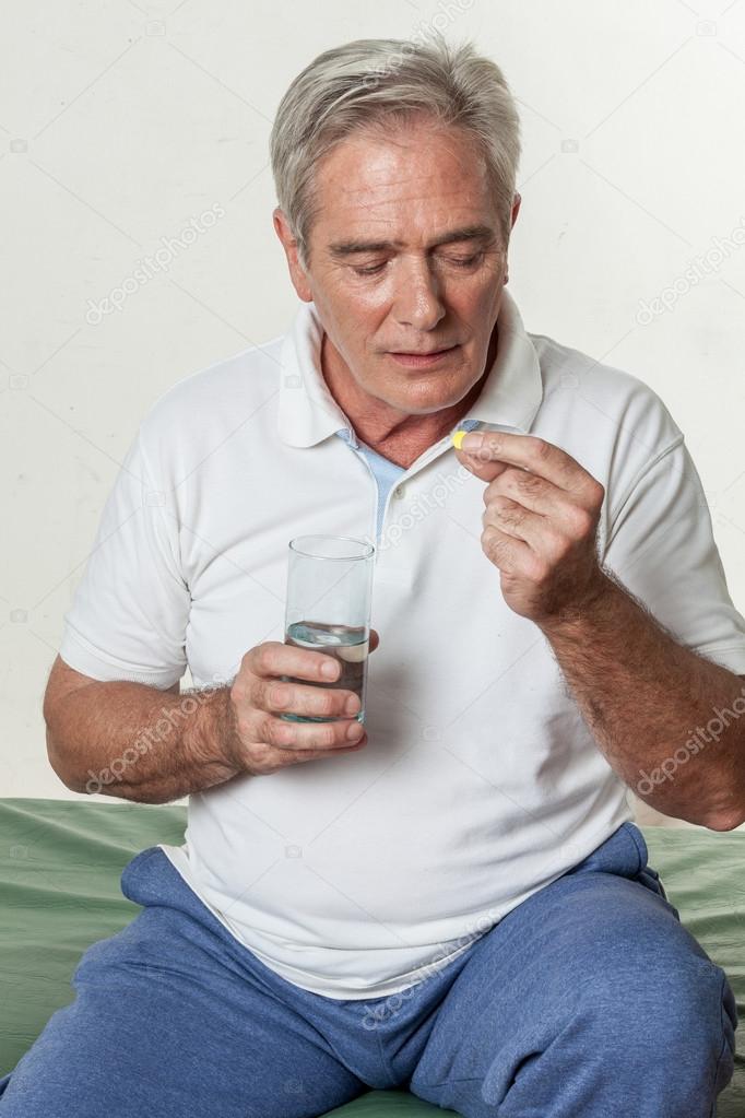 Man taking a pill