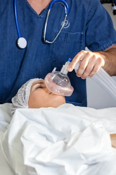 Doctor putting oxygen tube