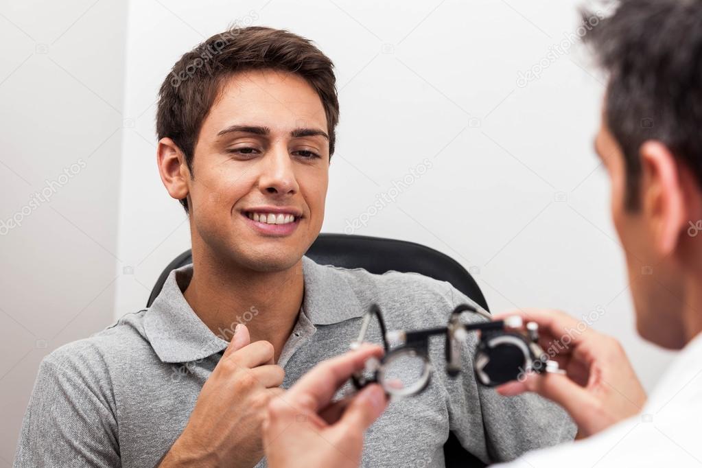 Man looking at the glasses