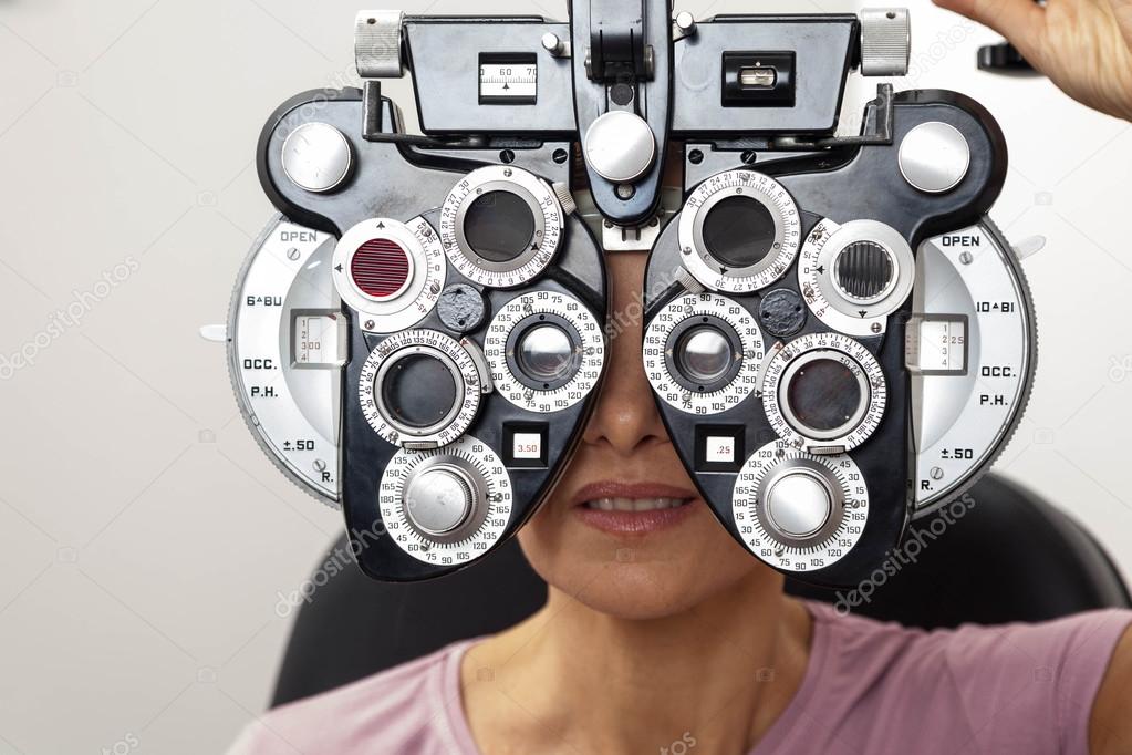Ophthalmologist performing  tests