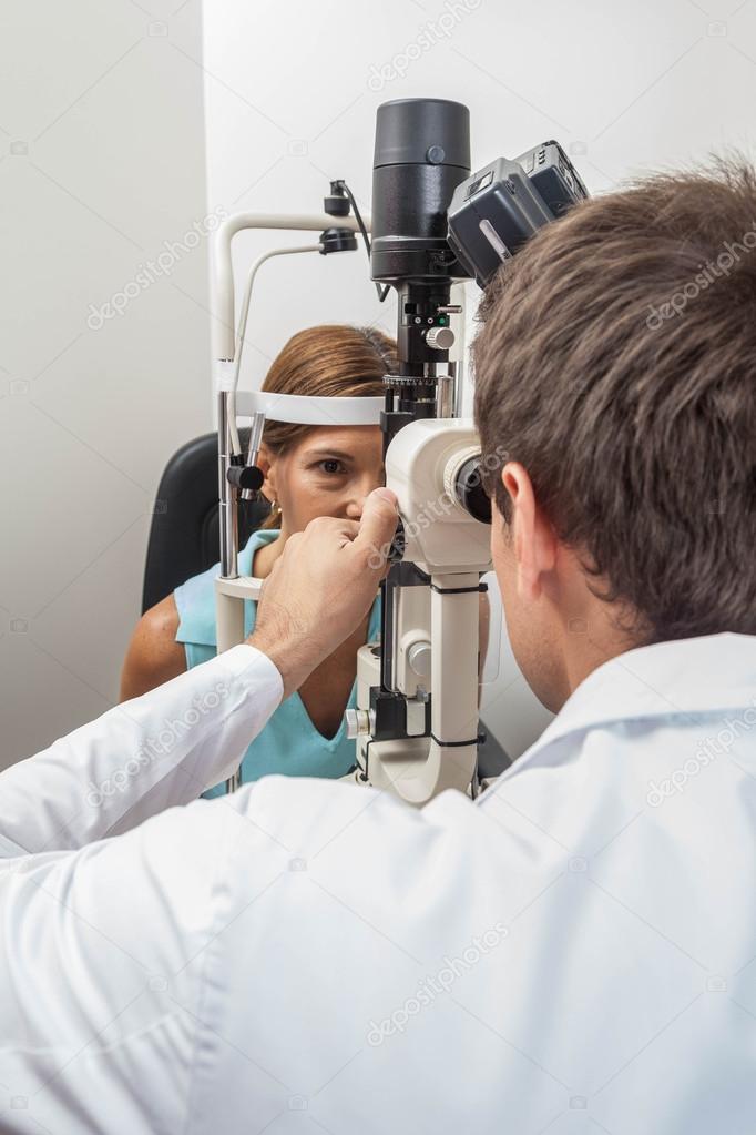 Ophthalmologist performing eye tests