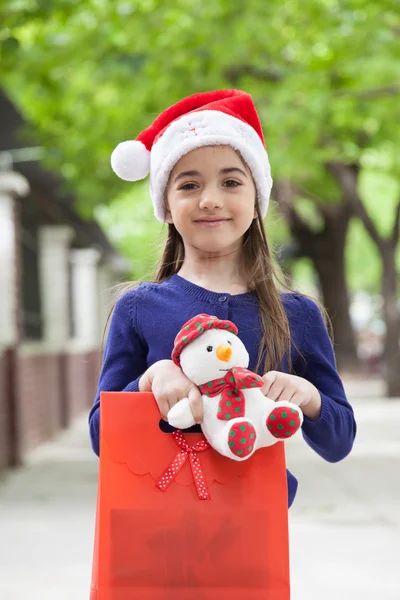 Meisje met kerstcadeaus — Stockfoto