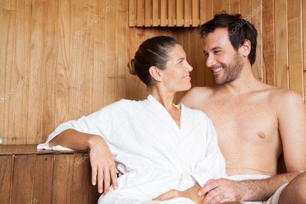 couple ralaxing in sauna