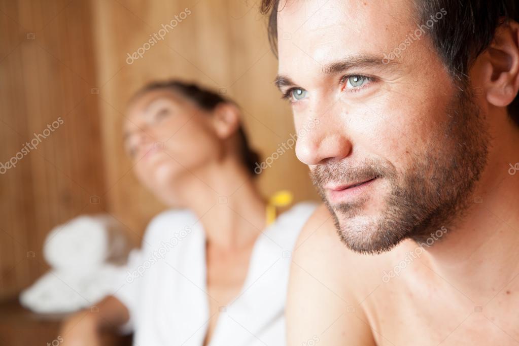 couple ralaxing in sauna