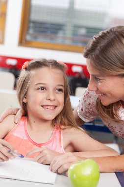 teacher helping a pupil
